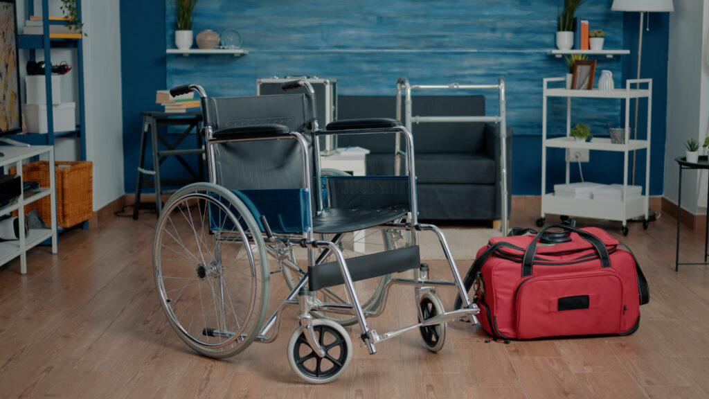 Empty nursing home room at facility for rehabilitation and healthcare. Nobody in space with wheelchair and medical equipment for elder people, giving assistance to ill patients.