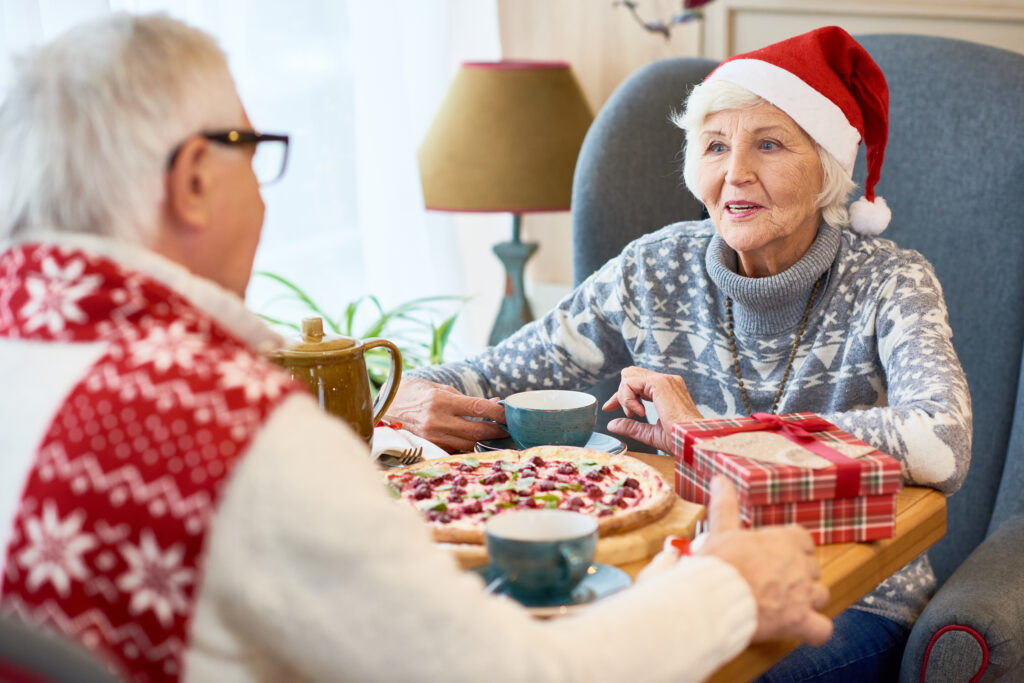 Happy Senior Couple Dining on Christmas